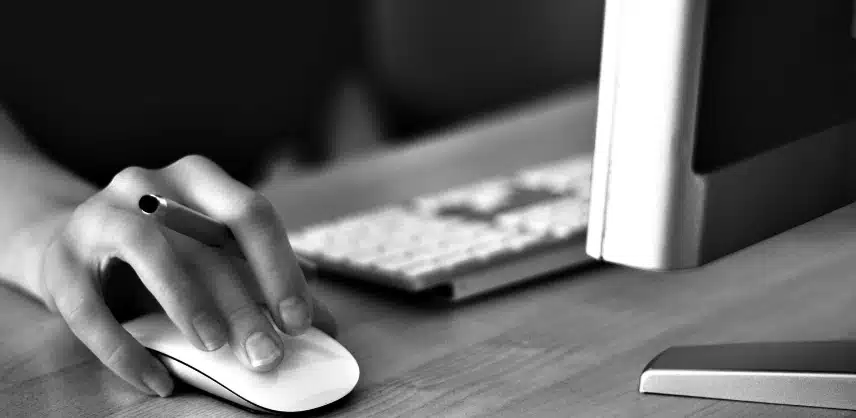 an image of a woman using a desktop computer