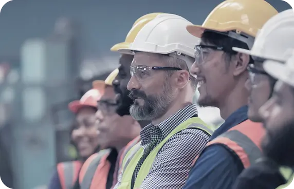 a number of energy professionals all wearing ppe and hard hats