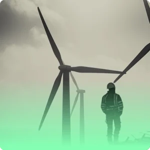 a man next to wind turbines